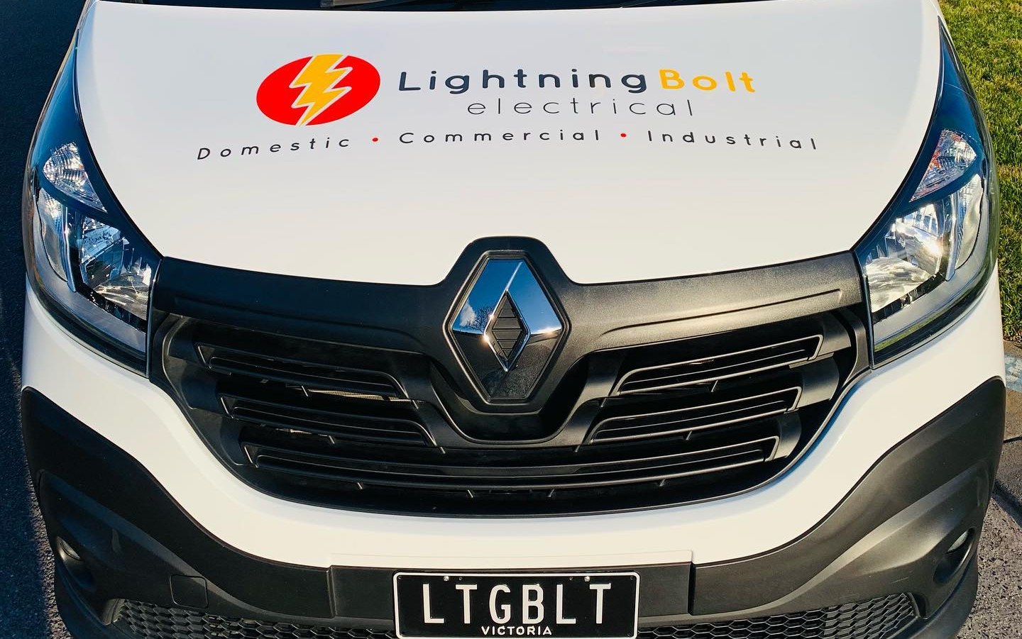 Front of the LightningBolt Electrical van with the logo on the bonnet and the custom LTGBLT number plate